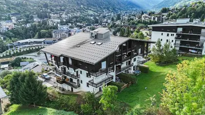 an aerial view of a large house in a city at Les Cimes de Saint-Gervais apartment in Saint-Gervais-les-Bains
