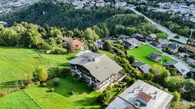 an aerial view of a large house with a yard at Les Cimes de Saint-Gervais apartment in Saint-Gervais-les-Bains