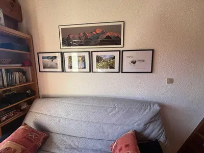 a bedroom with a bed and pictures on the wall at Charmant T2 Mezzanine au centre - Animaux acceptés - FR-1-624-187 in Samoëns