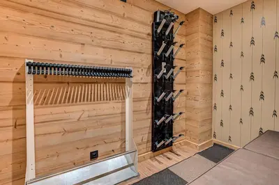 a wine cellar with a wall of wine bottles at Chalet Diard, Detached Chalet, Alpes Travel, Sleeps 6 to 8 in Chamonix-Mont-Blanc