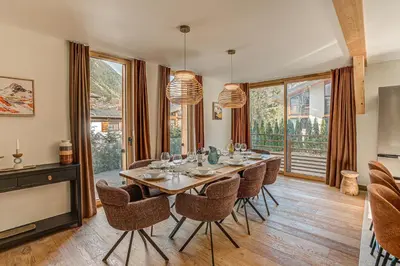 a dining room with a table and chairs at Chalet Diard, Detached Chalet, Alpes Travel, Sleeps 6 to 8 in Chamonix-Mont-Blanc