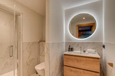 a bathroom with a sink and a toilet and a mirror at Chalet Diard, Detached Chalet, Alpes Travel, Sleeps 6 to 8 in Chamonix-Mont-Blanc