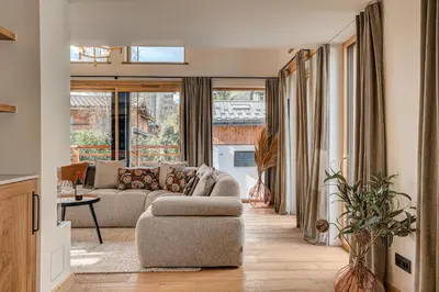a living room with a couch and a chair at Chalet Diard, Detached Chalet, Alpes Travel, Sleeps 6 to 8 in Chamonix-Mont-Blanc
