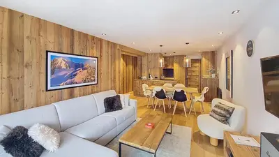 a living room with a couch and a table at Appartement Haut de gamme- Rochebrune aux pieds des pistes- 3 chambres in Megève