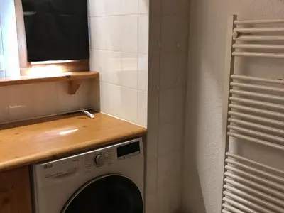 a washing machine in a bathroom with a window at Appartement 3 pièces - 6 pers. - Pied de piste avec garage - FR-1-836-14 in Arâches-la-Frasse