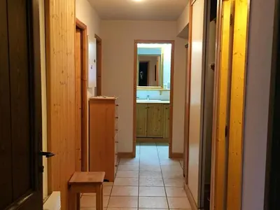 a hallway of a kitchen with a sink and a mirror at Appartement 3 pièces - 6 pers. - Pied de piste avec garage - FR-1-836-14 in Arâches-la-Frasse