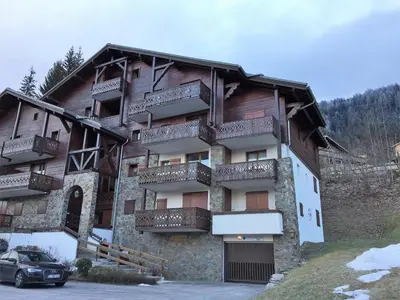 a building with balconies on the side of it at Appartement 3 pièces - 6 pers. - Pied de piste avec garage - FR-1-836-14 in Arâches-la-Frasse