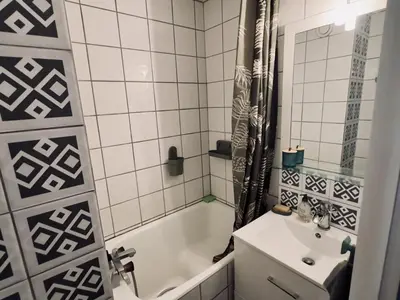 a bathroom with a tub and a sink and a shower at Studio cosy rénové avec balcon sud - 2 pers. - FR-1-836-15 in Arâches-la-Frasse