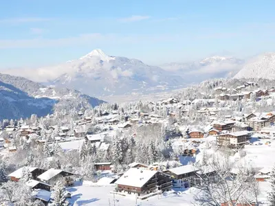 a village covered in snow with a mountain in the background at Charmant T2 à Arâches-la-Frasse, pour 4 personnes - FR-1-836-19 in Arâches-la-Frasse