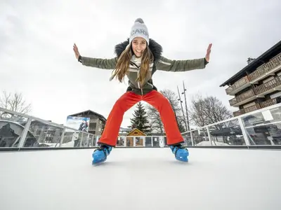 a young woman is dancing on the ice at Charmant T2 à Arâches-la-Frasse, pour 4 personnes - FR-1-836-19 in Arâches-la-Frasse
