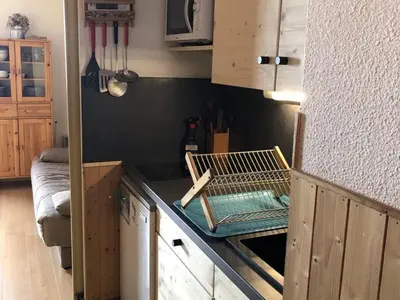 a kitchen with a counter with a dish rack on it at Studio 4 pers avec balcon au pied des pistes - FR-1-687-117 in Arâches-la-Frasse