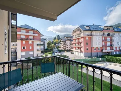 a balcony with a bench and some buildings at Appartement cosy à Saint-Gervais, proche télécabine, parking inclus - FR-1-663-57 in Saint-Gervais-les-Bains