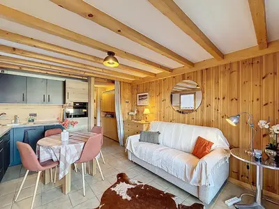 a living room with a couch and a table at Appartement cosy avec balcon près du centre de Combloux - FR-1-560-170 in Combloux