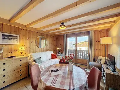 a living room with a couch and a table at Appartement cosy avec balcon près du centre de Combloux - FR-1-560-170 in Combloux