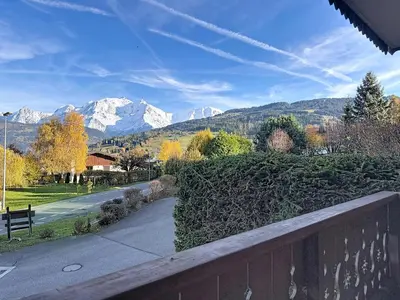 a view of snow capped mountains from a house at Appartement cosy avec balcon près du centre de Combloux - FR-1-560-170 in Combloux