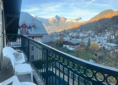 a balcony with a view of a city and mountains at Résidence Les Arolles - Bat Melezes - LES MELEZES - C332 MAE-3363 in Saint-Gervais-les-Bains