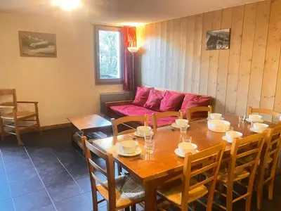 a dining room with a table and a couch at Résidence Les Arolles - Bat Melezes - LES MELEZES - C332 MAE-3363 in Saint-Gervais-les-Bains