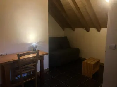 a small room with a table and a couch at Résidence Les Arolles - Bat Melezes - LES MELEZES - C332 MAE-3363 in Saint-Gervais-les-Bains