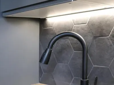 a kitchen with a sink and a stove top oven at Studio rénové et cosy avec Wifi et animaux admis proche centre - FR-1-836-21 in Arâches-la-Frasse
