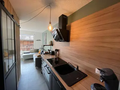 a bathroom with a toilet and a shelf on the wall at Appartement rénové 2 pièces, centre station, garage, animaux admis - FR-1-836-24 in Arâches-la-Frasse