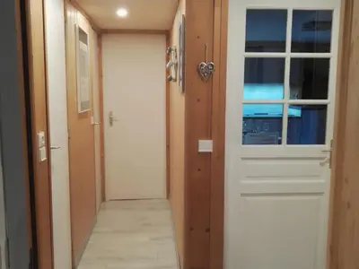 a hallway with a white door and a hallwayngth at Charmant 2 pièces aux Carroz d'Arâches avec parking et WIFI - 4 personnes - FR-1-836-23 in Arâches-la-Frasse