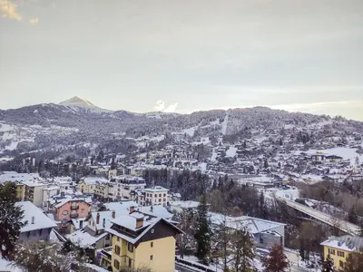 an apartment building with a tree in front of it at Apartment Bel Alp-1 by Interhome in Saint-Gervais-les-Bains