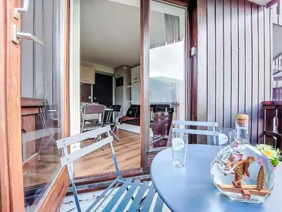 a leather couch and a chair in a room at Studio L'aiguille noire by Interhome in Bionnay