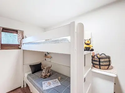 a white bunk bed in a small room with a shelf at Studio L'aiguille noire by Interhome in Bionnay