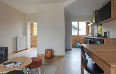 a kitchen with a counter and a table in a room at Apartment Safi in Chamonix-Mont-Blanc