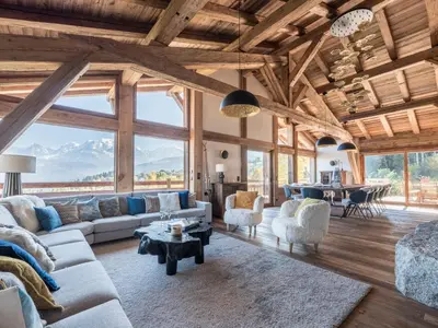 a living room with couches and chairs and a table at Chalet Marianna I Le Chalet Club in Combloux