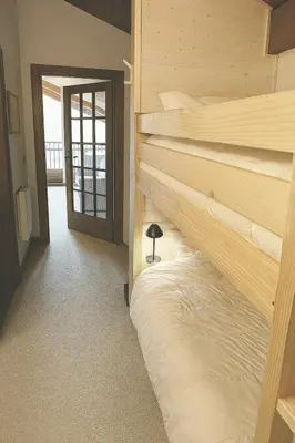 a bedroom with a bed in a room at F1 tout confort Megève skis aux pieds in Megève