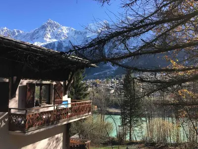 a house with a balcony with a view of a mountain at Petite Floria in Les Houches