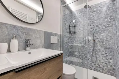 a bathroom with a sink and a shower at Nid du Pic - Cozy alpine retreat with private garden in Chamonix in Chamonix-Mont-Blanc