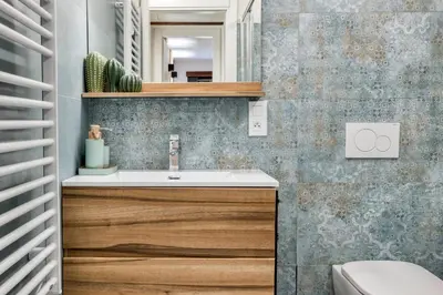 a bathroom with a sink and a mirror at Nid du Pic - Cozy alpine retreat with private garden in Chamonix in Chamonix-Mont-Blanc