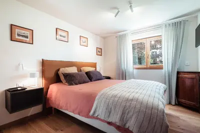 a bedroom with a bed and a window at Chalet Mont Plaisir - Au pied des Drus in Chamonix-Mont-Blanc