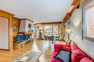 a living room with a couch and a table at Appartement Mercier - Welkeys in Megève