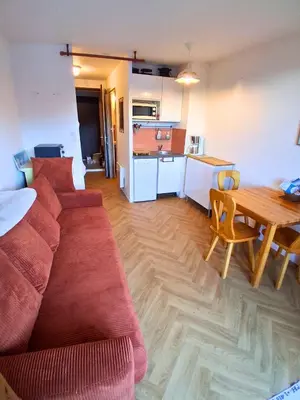 a bathroom with a tub and a sink and a mirror at Studio SnowCarroz with a view for 4 people in Arâches-la-Frasse