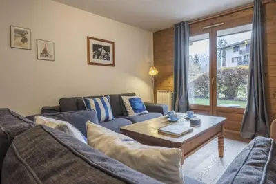 a living room with a couch and a coffee table at Capucins in Chamonix-Mont-Blanc