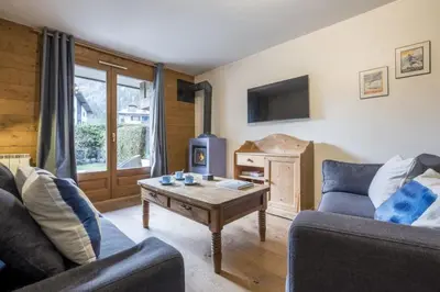 a living room with two couches and a coffee table at Capucins in Chamonix-Mont-Blanc