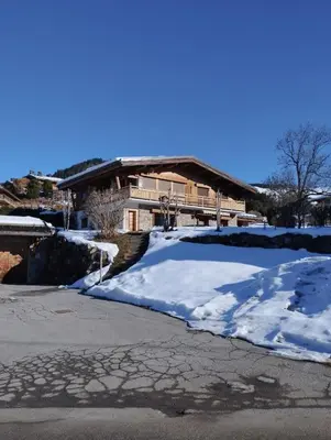 a car parked in front of a house at Appartement Mont d'Arbois in Megève