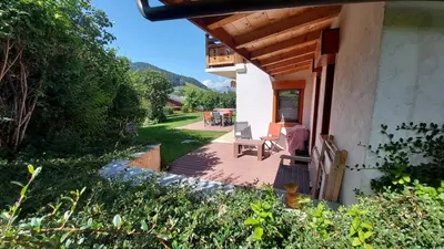 a kitchen with a wooden table and a kitchen with a sink at Appartement Mont d'Arbois in Megève