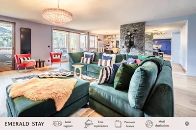 a living room with a green couch and chairs at Apartment Spritz Megève - by EMERALD STAY in Megève