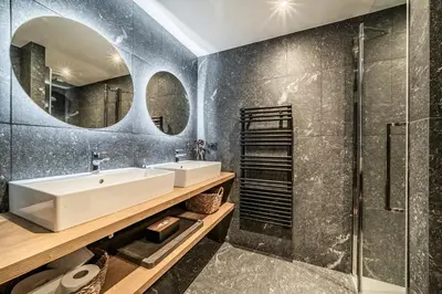 a bathroom with a sink and a shower at Apartment Spritz Megève - by EMERALD STAY in Megève