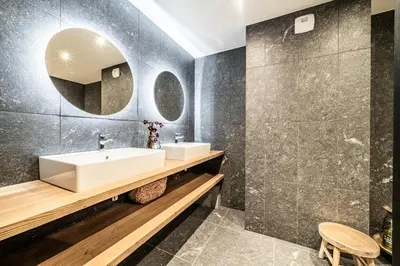 a bathroom with a sink and a mirror at Apartment Spritz Megève - by EMERALD STAY in Megève