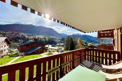 a balcony with a view of a mountain at Bright apartment with balcony and stunning views in Megève