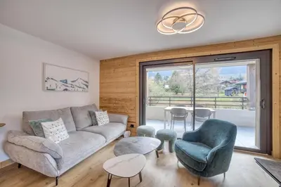 a living room with a couch and chairs and a table at Cosmiques A203 - New & Mont Blanc view in Les Houches