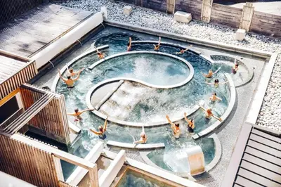 an overhead view of people in a swimming pool at Refuge des Cols Verts Parking Cozy Relaxing in Saint-Gervais-les-Bains