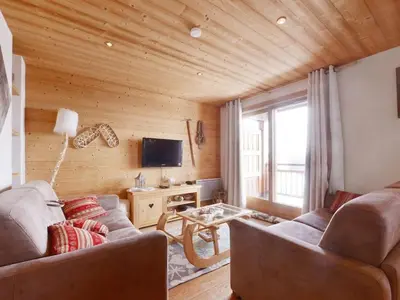 a living room with a couch and a tv at Spacieux appartement 96 m² à Flaine Hameau avec piscine et parking - FR-1-687-119 in Arâches-la-Frasse