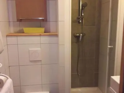 a bathroom with a shower with a glass door at Spacieux appartement 96 m² à Flaine Hameau avec piscine et parking - FR-1-687-119 in Arâches-la-Frasse