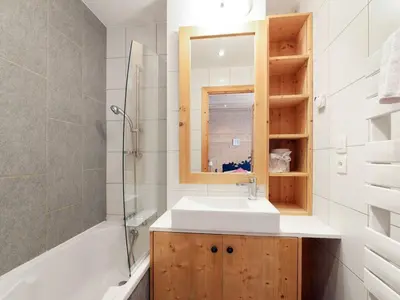 a bathroom with a sink and a shower and a mirror at Spacieux appartement 96 m² à Flaine Hameau avec piscine et parking - FR-1-687-119 in Arâches-la-Frasse